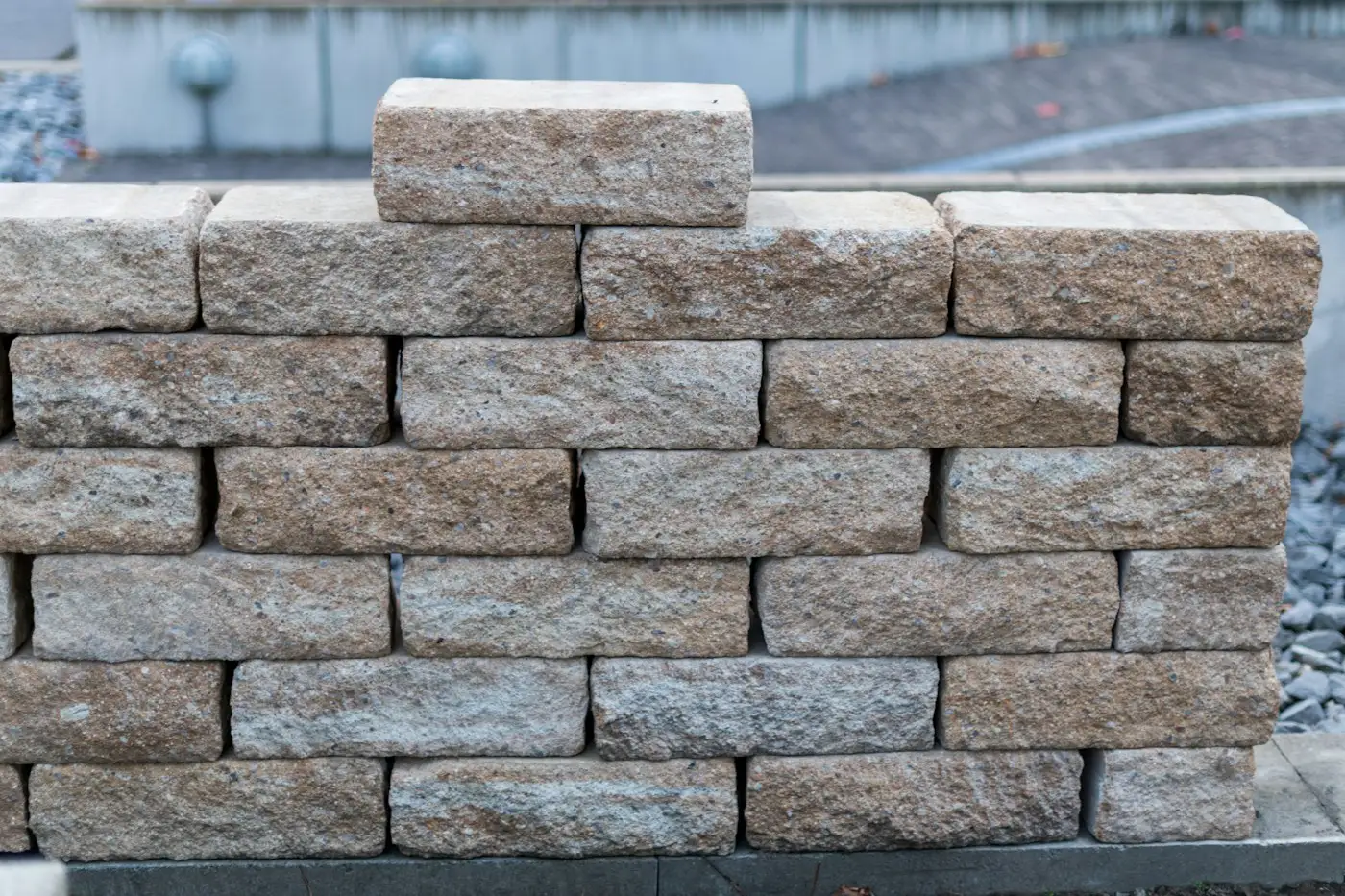Neatly stacked stone wall blocks